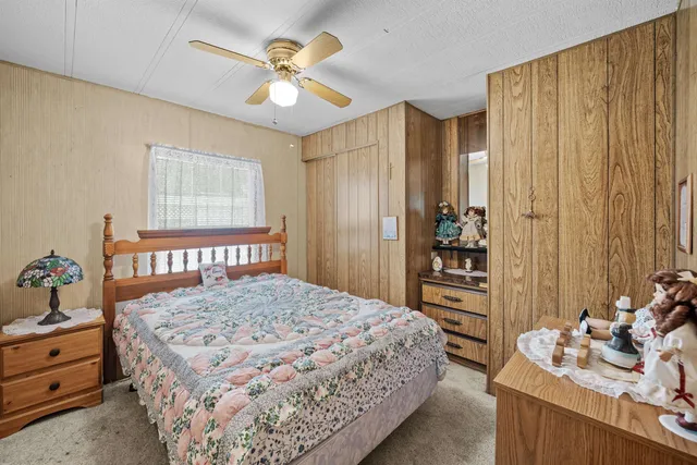 a bedroom with a bed and a dresser