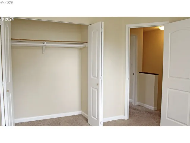 a bathroom with a sink a toilet and a shower curtain