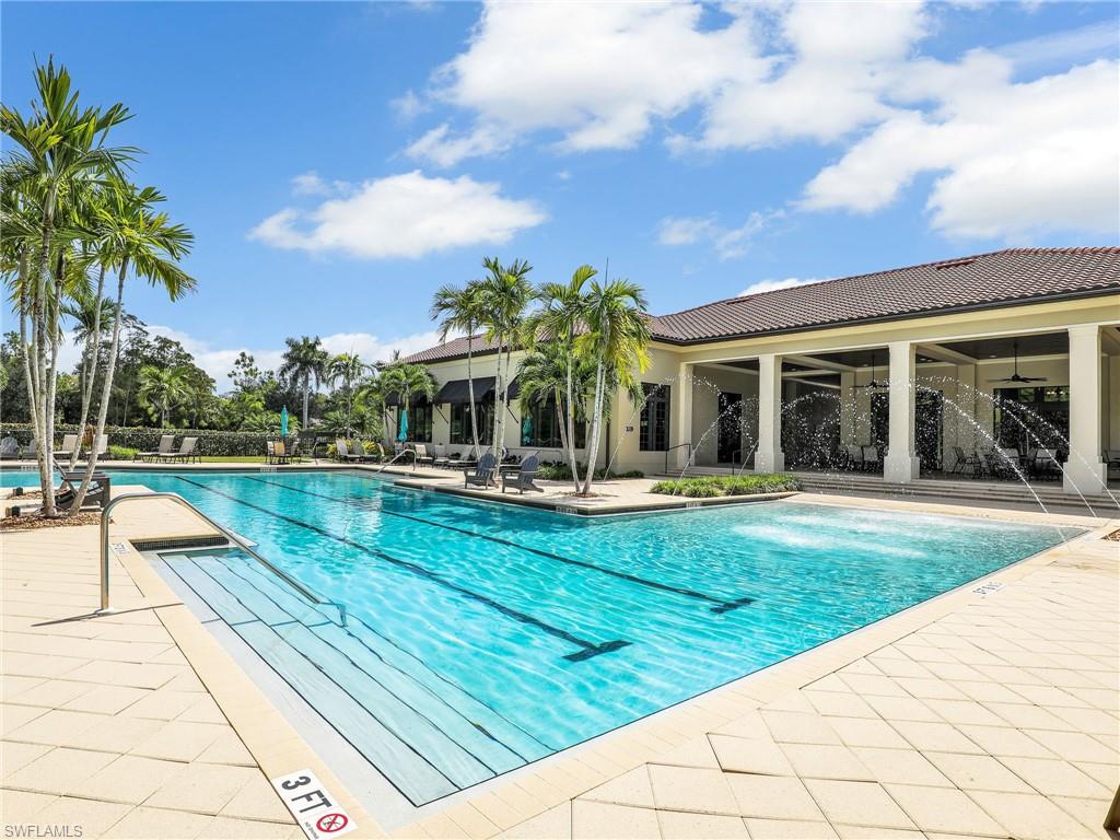 4383 Bismark Way Naples, FL 34119 - Photo 41 of 49 Community Pool With Lap Lanes & Rear View of Club House