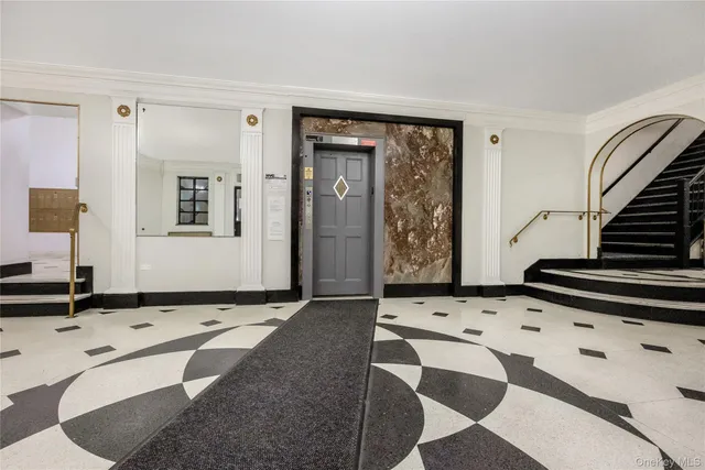 a view of an entryway with wooden floor