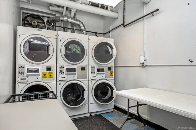 a view of a building with a bench next to a road