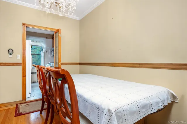 a bed sitting in a bedroom next to a bathroom