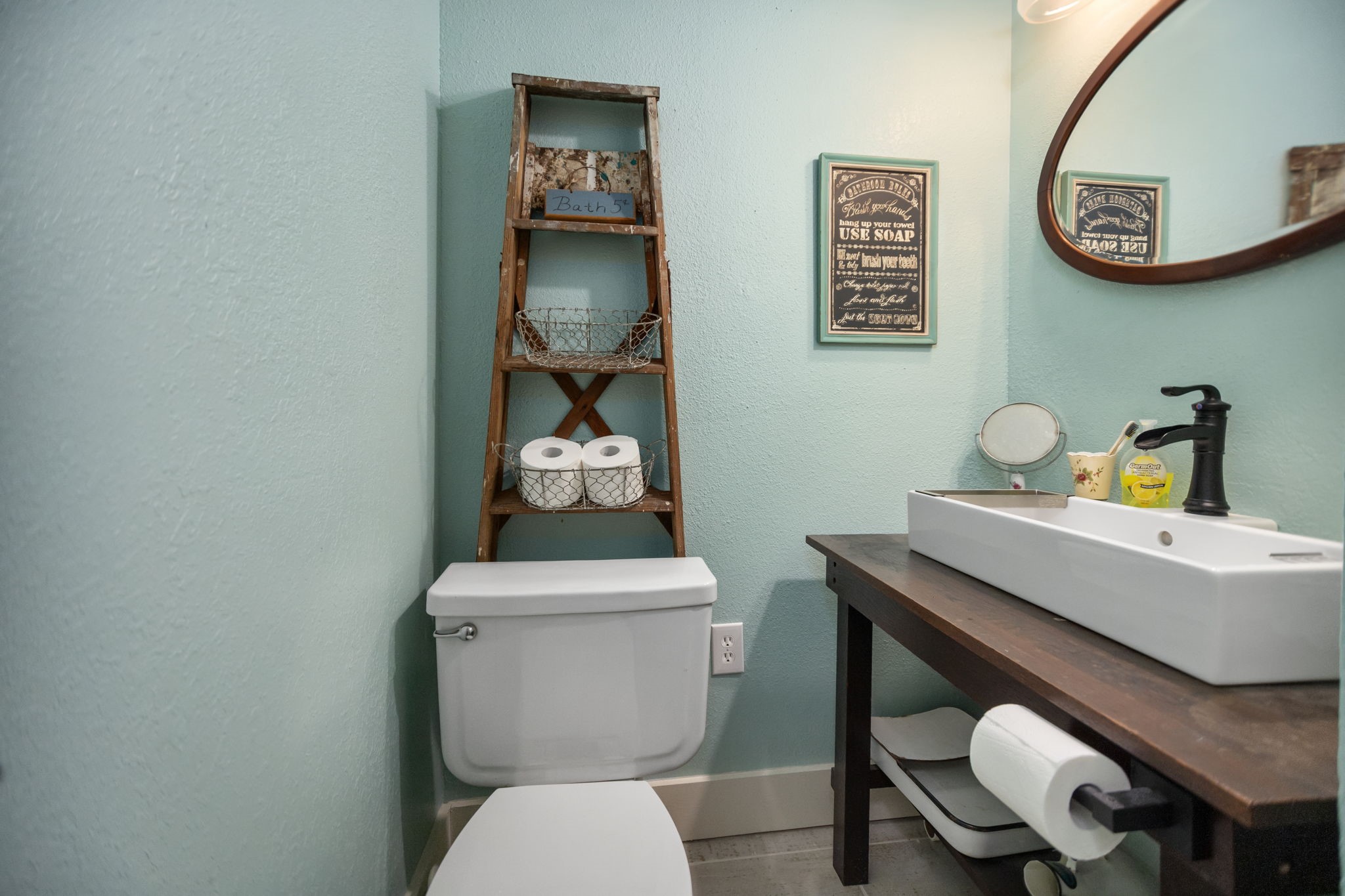 160 Dailey Road Crockett, TX 75835 - Photo 21 of 40 a bathroom with a toilet a sink and mirror