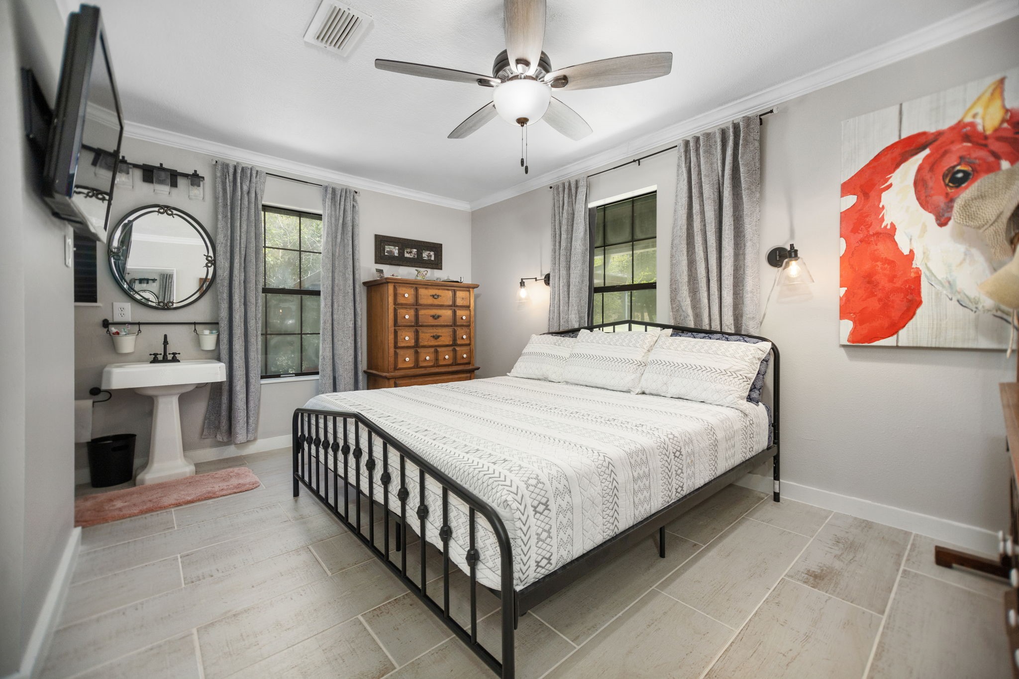 160 Dailey Road Crockett, TX 75835 - Photo 23 of 40 a bedroom with a large bed and a chandelier