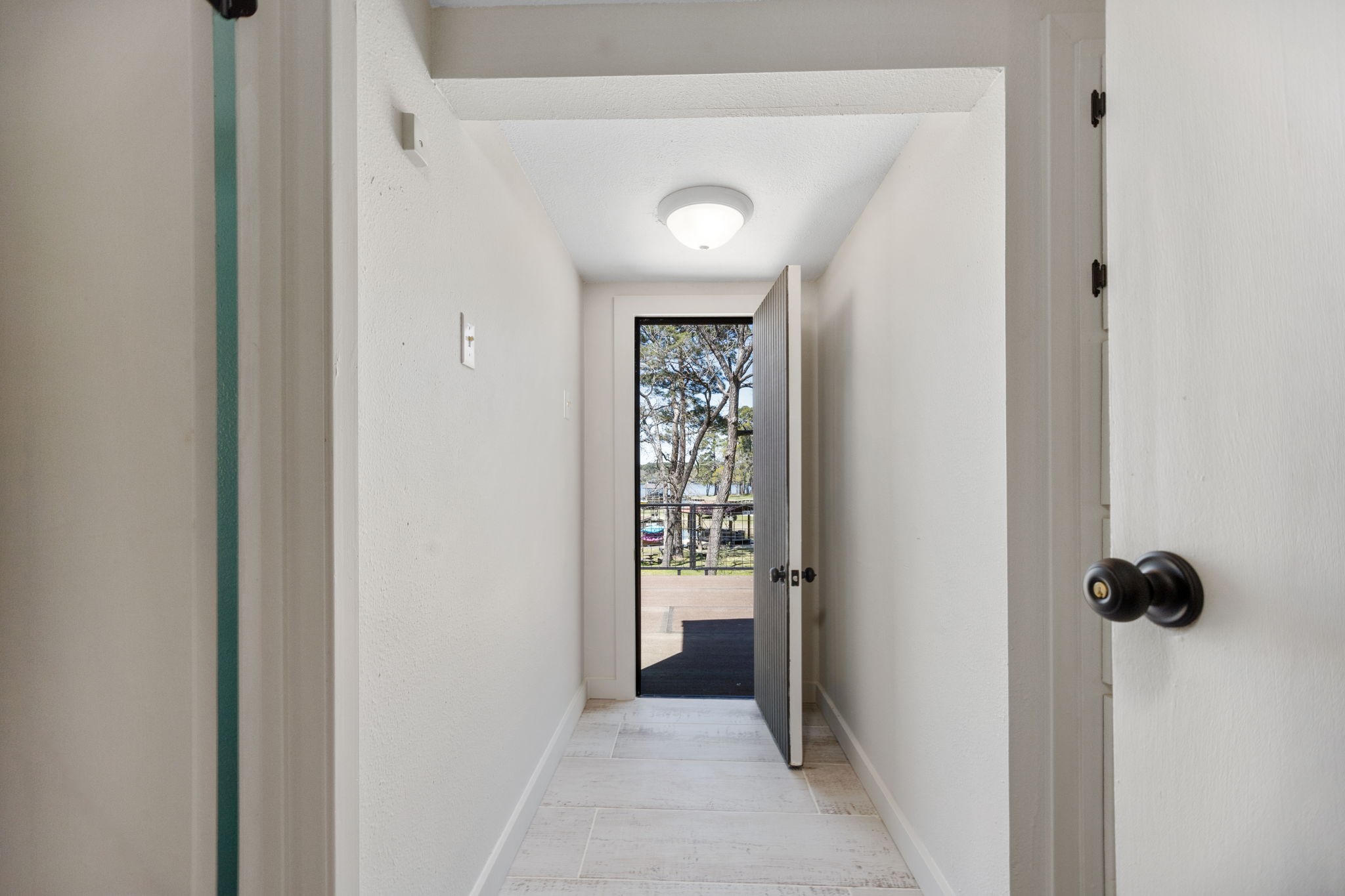 160 Dailey Road Crockett, TX 75835 - Photo 28 of 40 a view of a hallway with wooden shelves