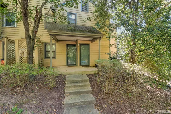 a view of a brick house with windows