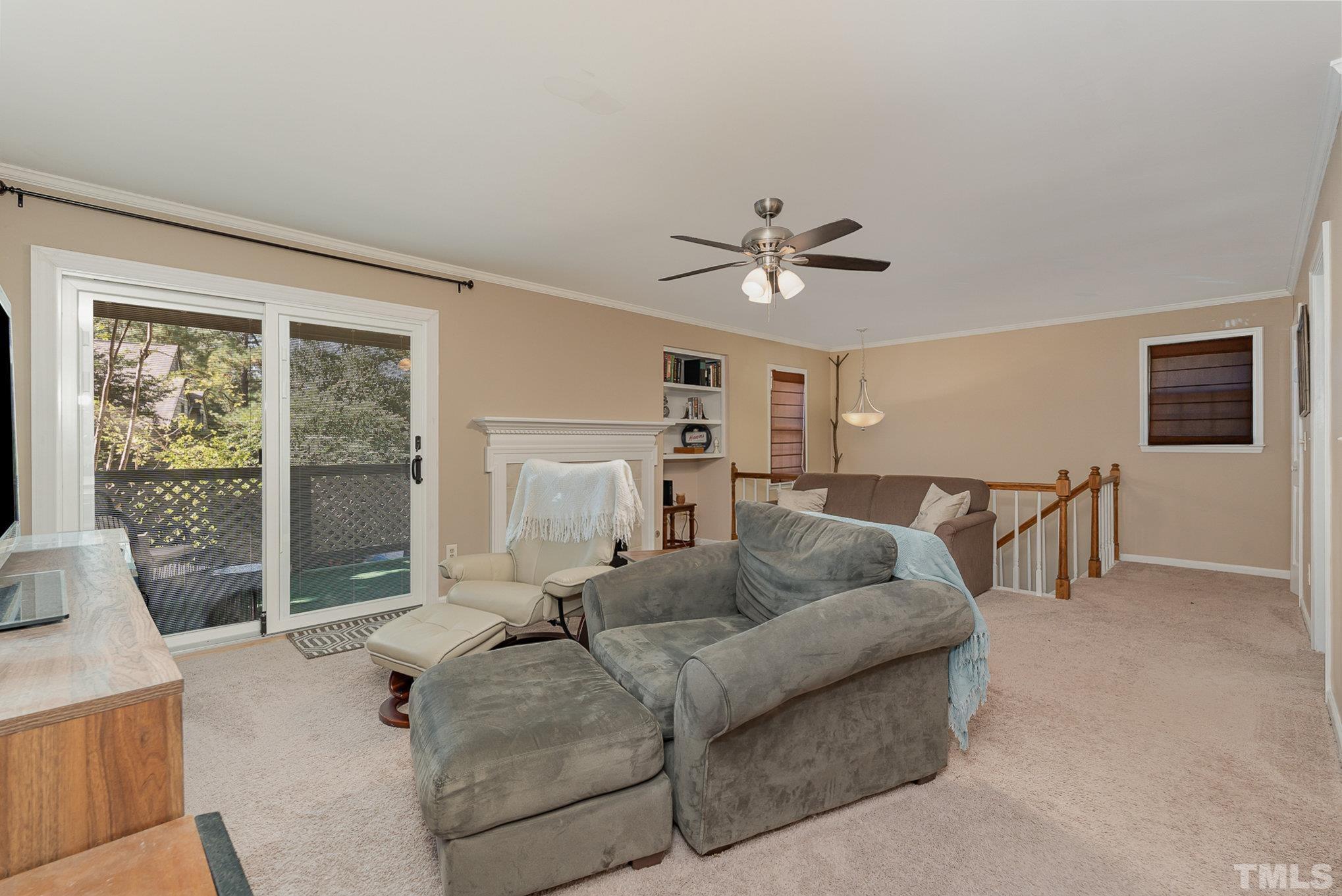 101 Autumn Chase Drive Raleigh, NC 27613 - Photo 3 of 18 a living room with furniture and a large window