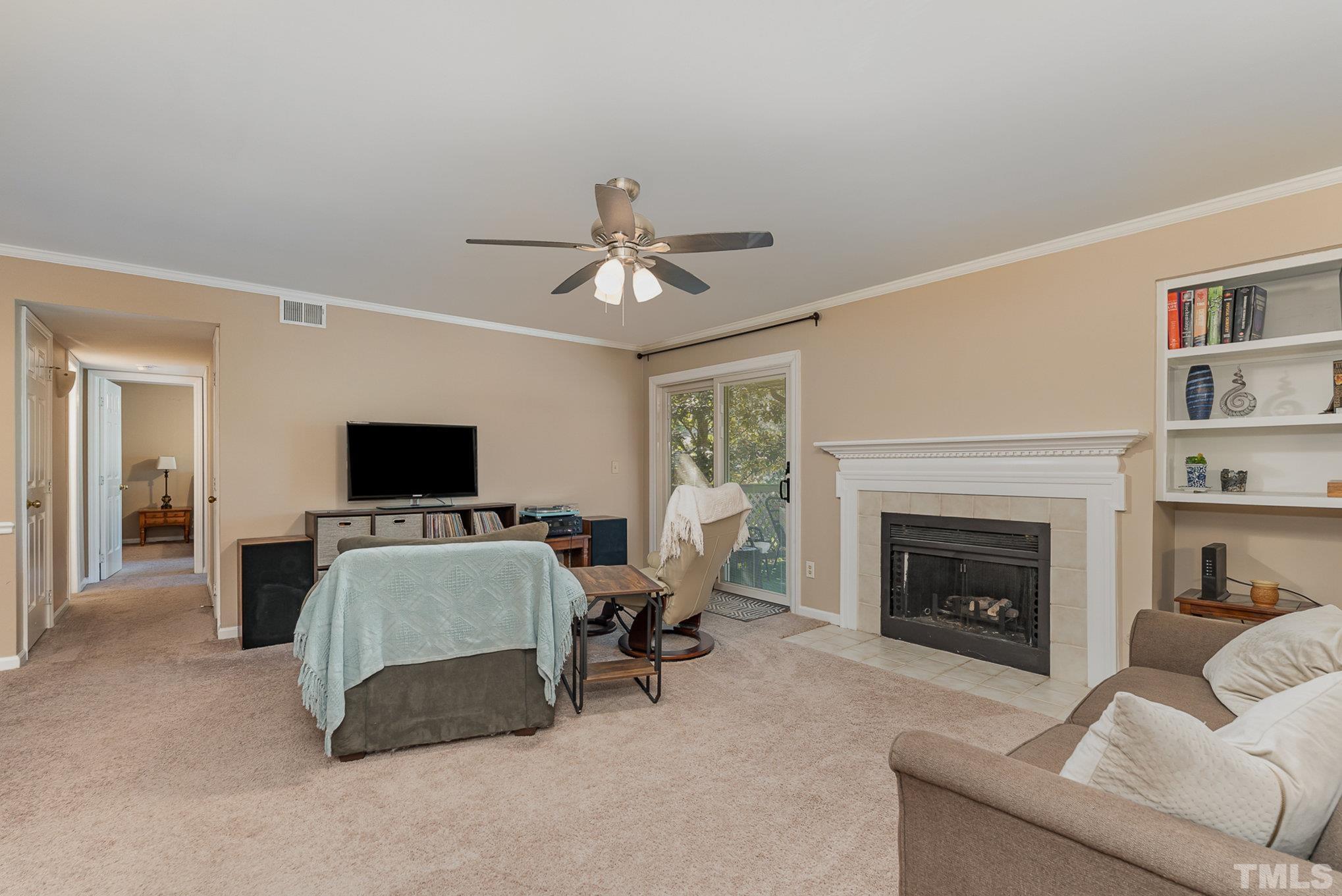 101 Autumn Chase Drive Raleigh, NC 27613 - Photo 5 of 18 a living room with furniture and a fireplace