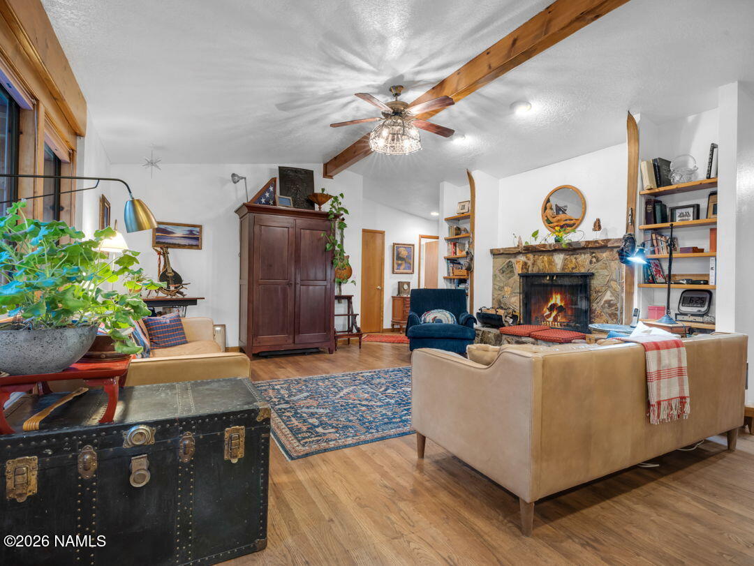 1005 Park Way Williams, AZ 86046 - Photo 12 of 45 a living room with furniture and a fireplace