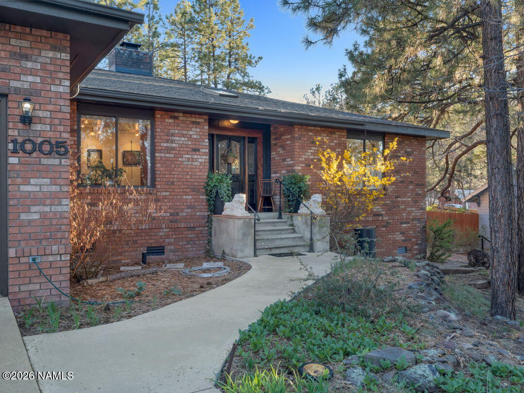 1005 Park Way Williams, AZ 86046 - Photo 2 of 45 a view of a porch with furniture and garden