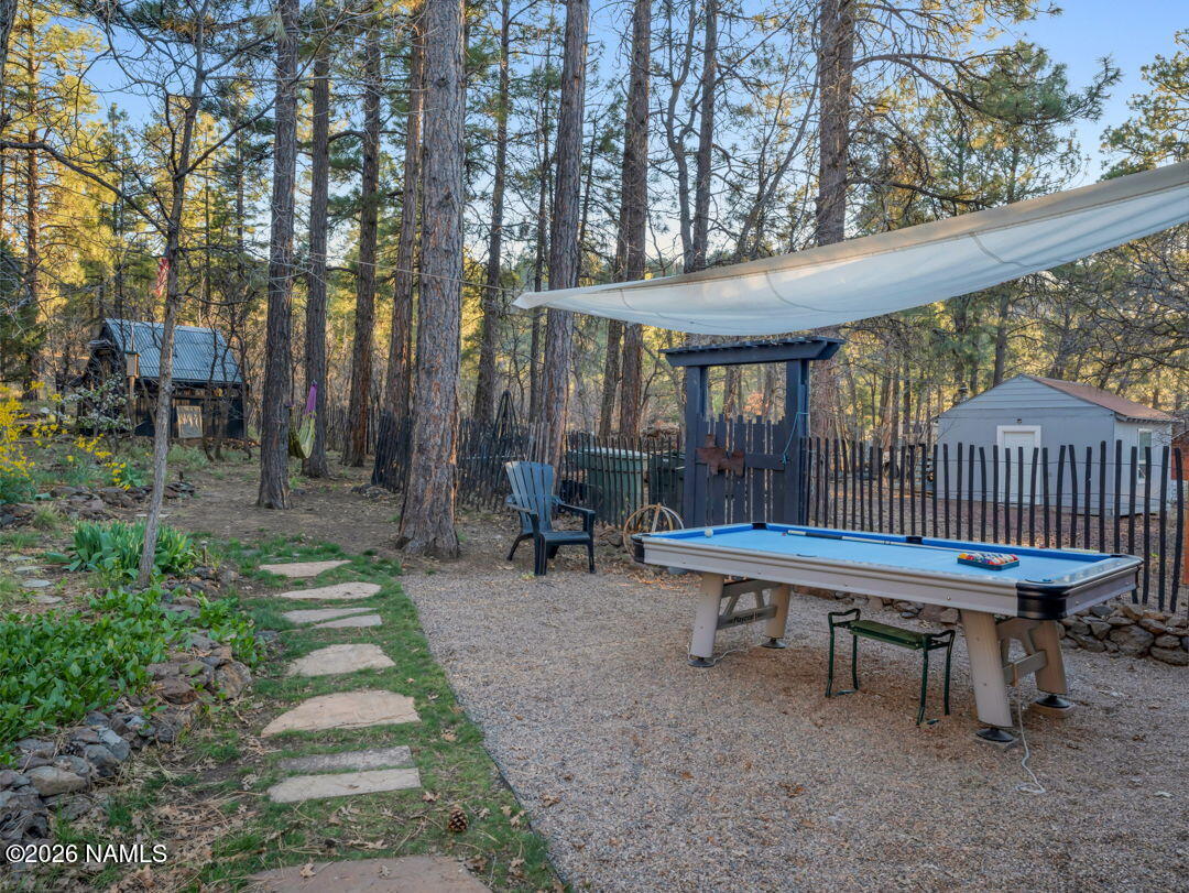 1005 Park Way Williams, AZ 86046 - Photo 41 of 45 a view of a patio with a table chairs and a yard