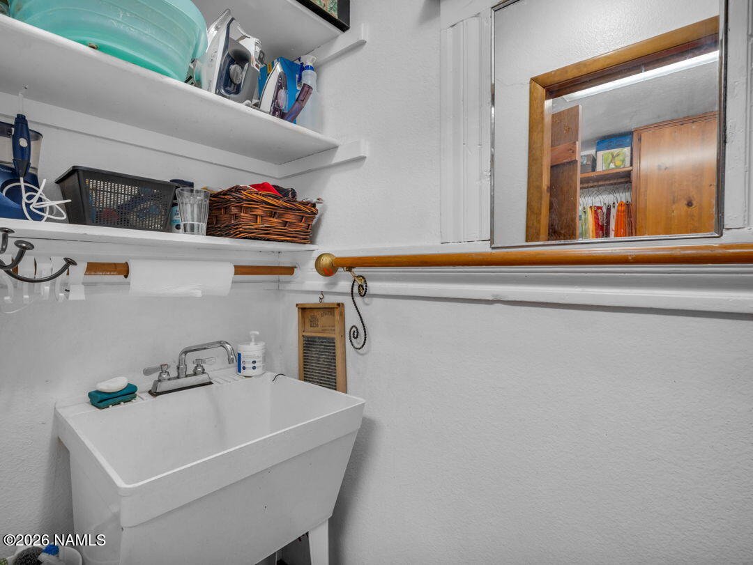 1005 Park Way Williams, AZ 86046 - Photo 43 of 45 a white kitchen with a sink and a refrigerator