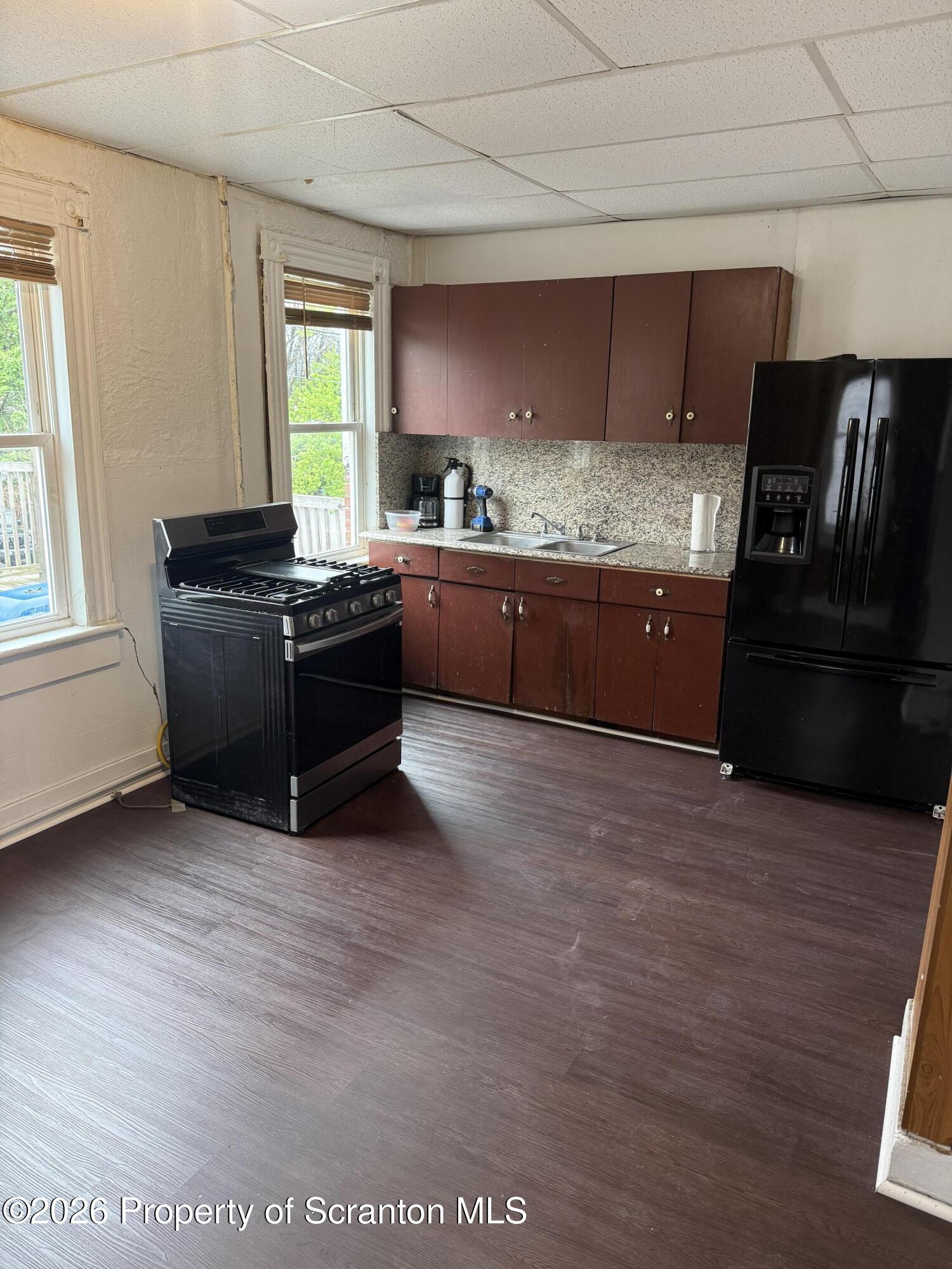 2 Ferguson Place Dunmore, PA 18509 - Photo 13 of 33 a kitchen with a refrigerator and a stove