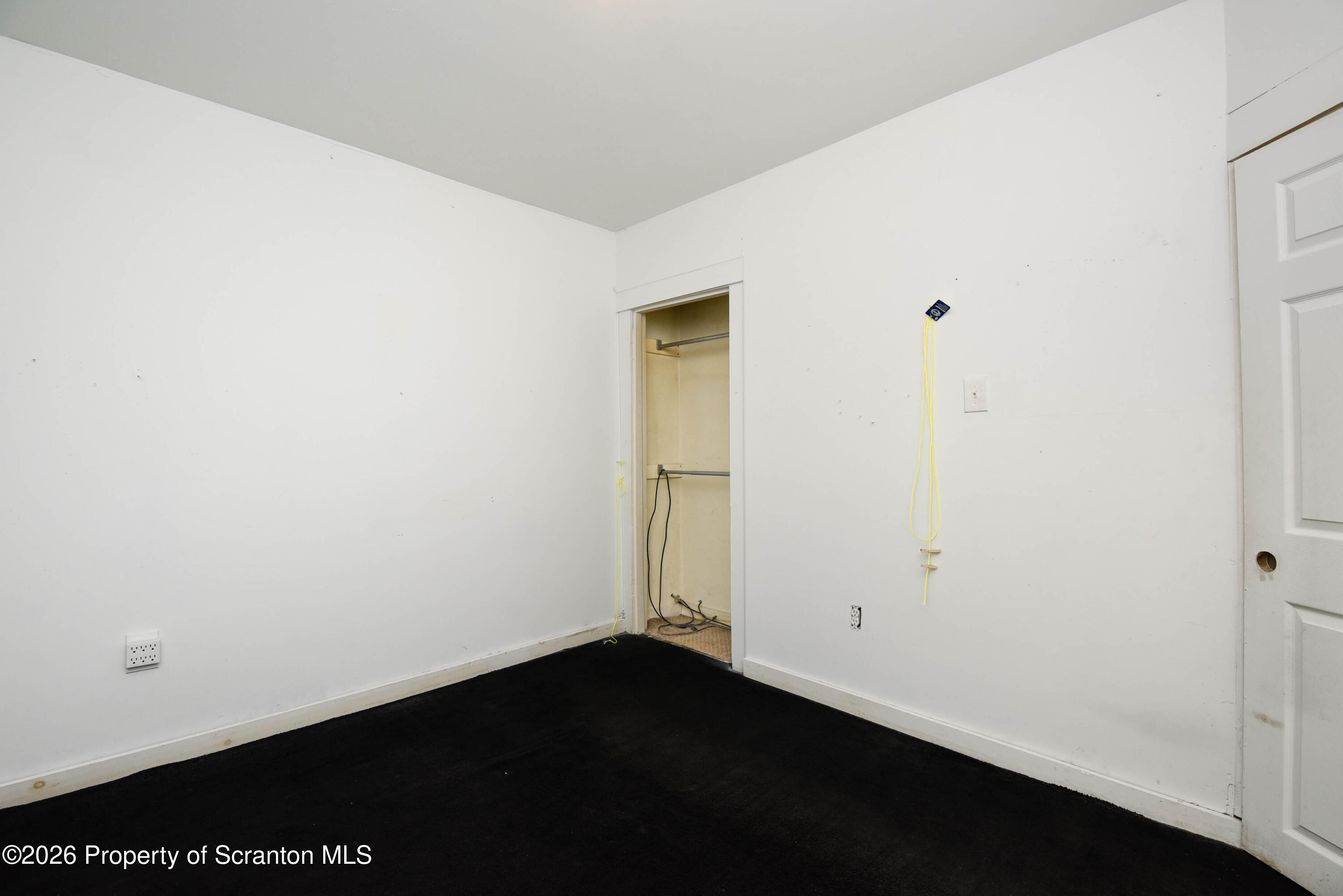 2 Ferguson Place Dunmore, PA 18509 - Photo 17 of 33 an empty room with a wooden door