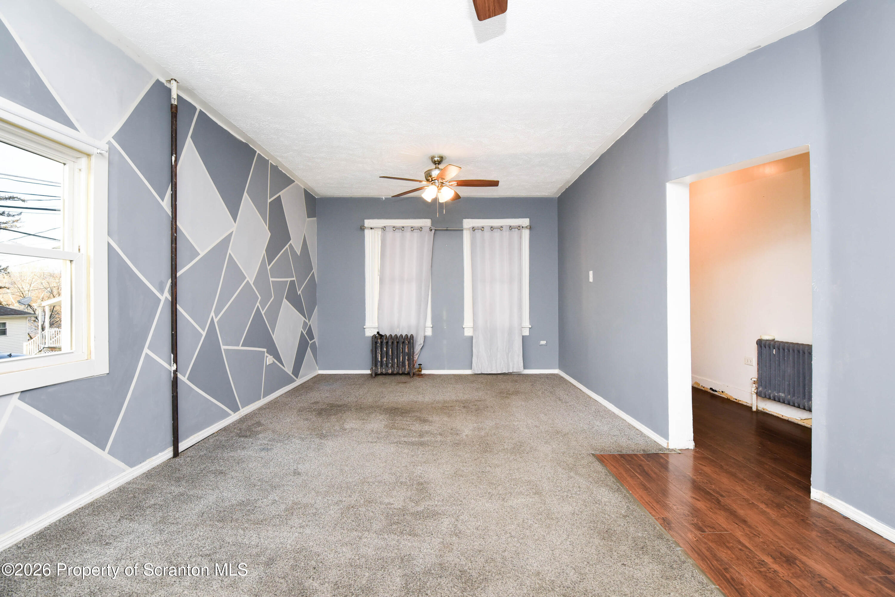 2 Ferguson Place Dunmore, PA 18509 - Photo 7 of 33 wooden floor in an empty room with a window