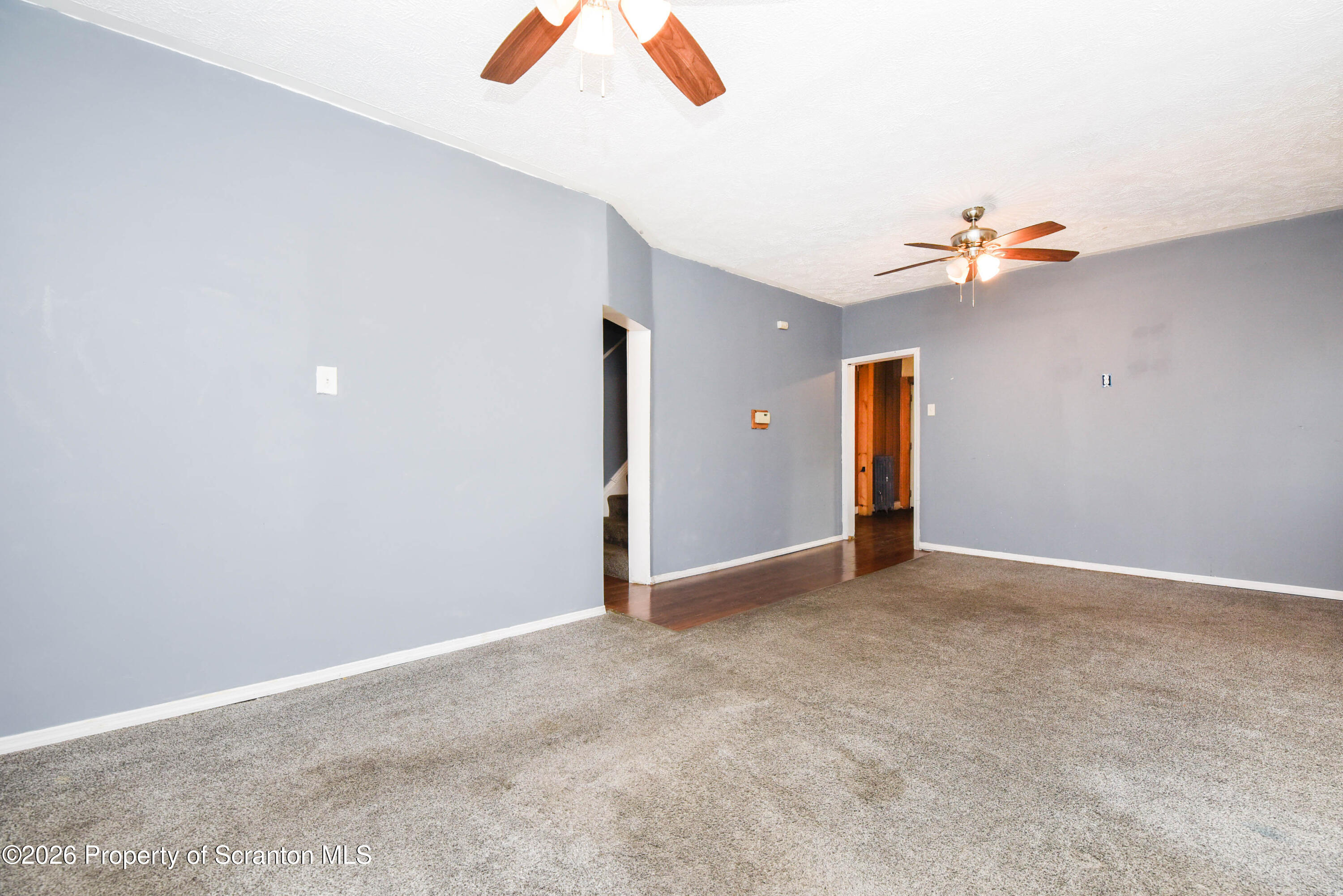 2 Ferguson Place Dunmore, PA 18509 - Photo 9 of 33 an empty room with closet and a chandelier fan