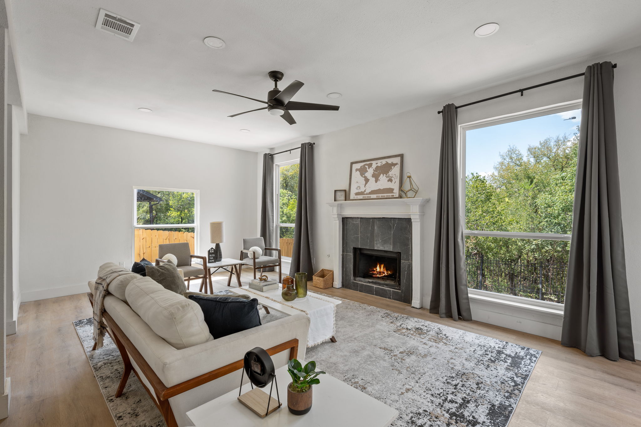 a living room with furniture and a fireplace