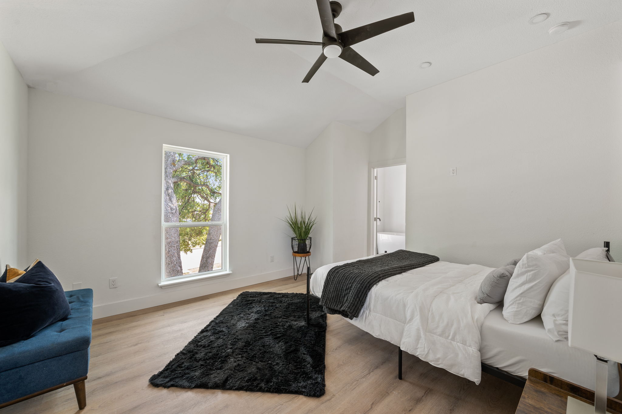 11604 Loweswater Lane Austin, TX 78754 - Photo 18 of 34 a bedroom with a bed and a window