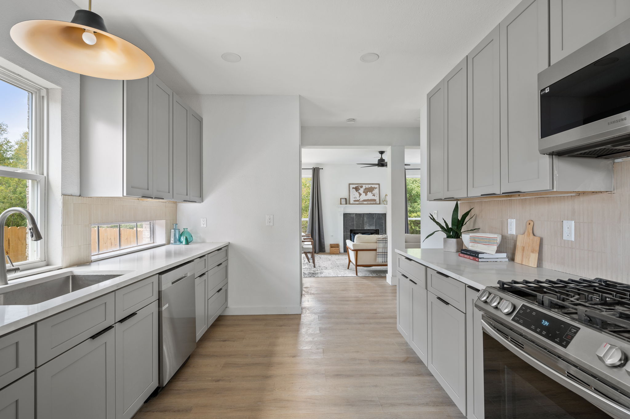 11604 Loweswater Lane Austin, TX 78754 - Photo 2 of 34 a kitchen with stainless steel appliances a stove a sink and a refrigerator