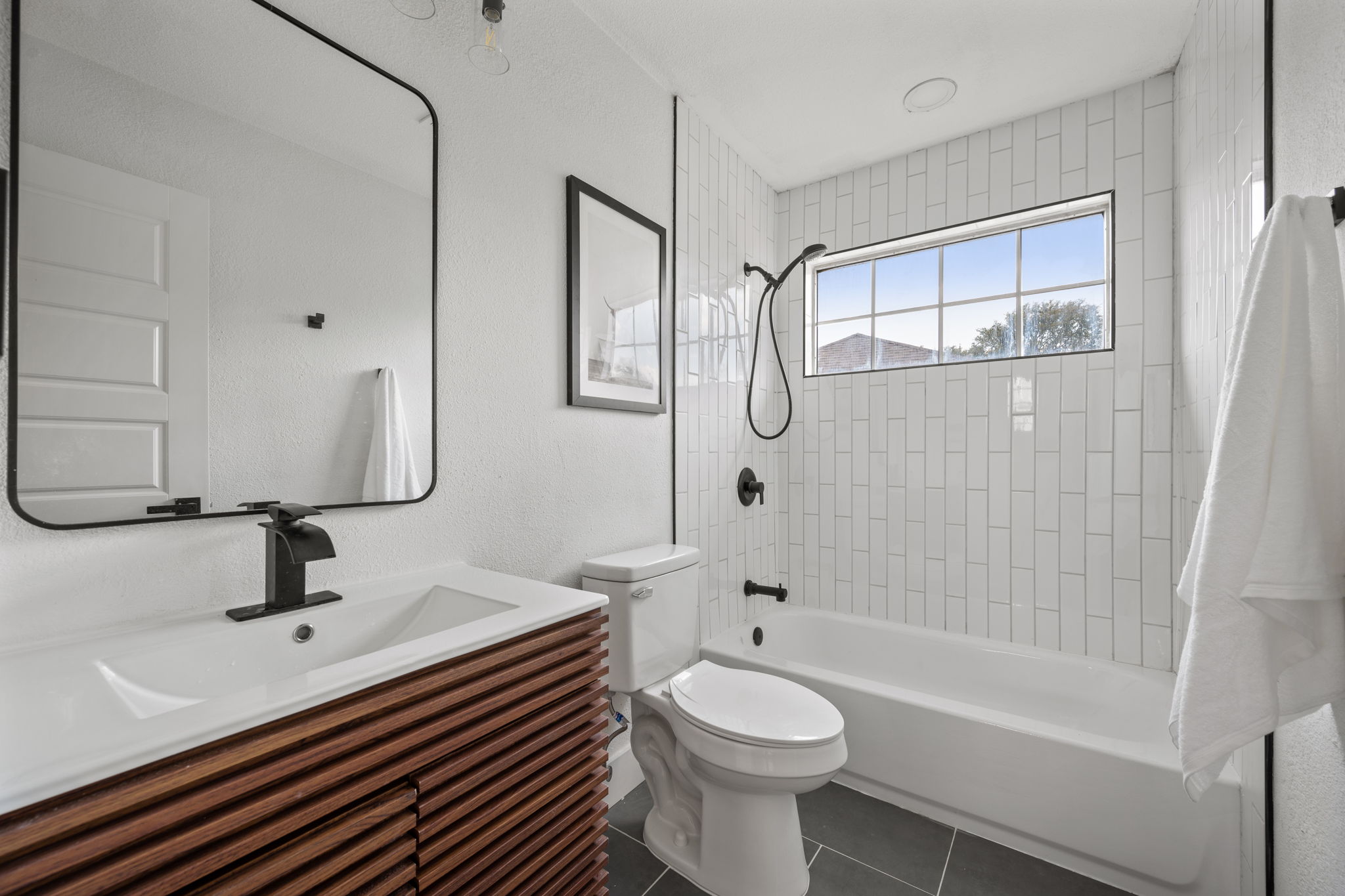 11604 Loweswater Lane Austin, TX 78754 - Photo 25 of 34 a bathroom with a sink a toilet and shower