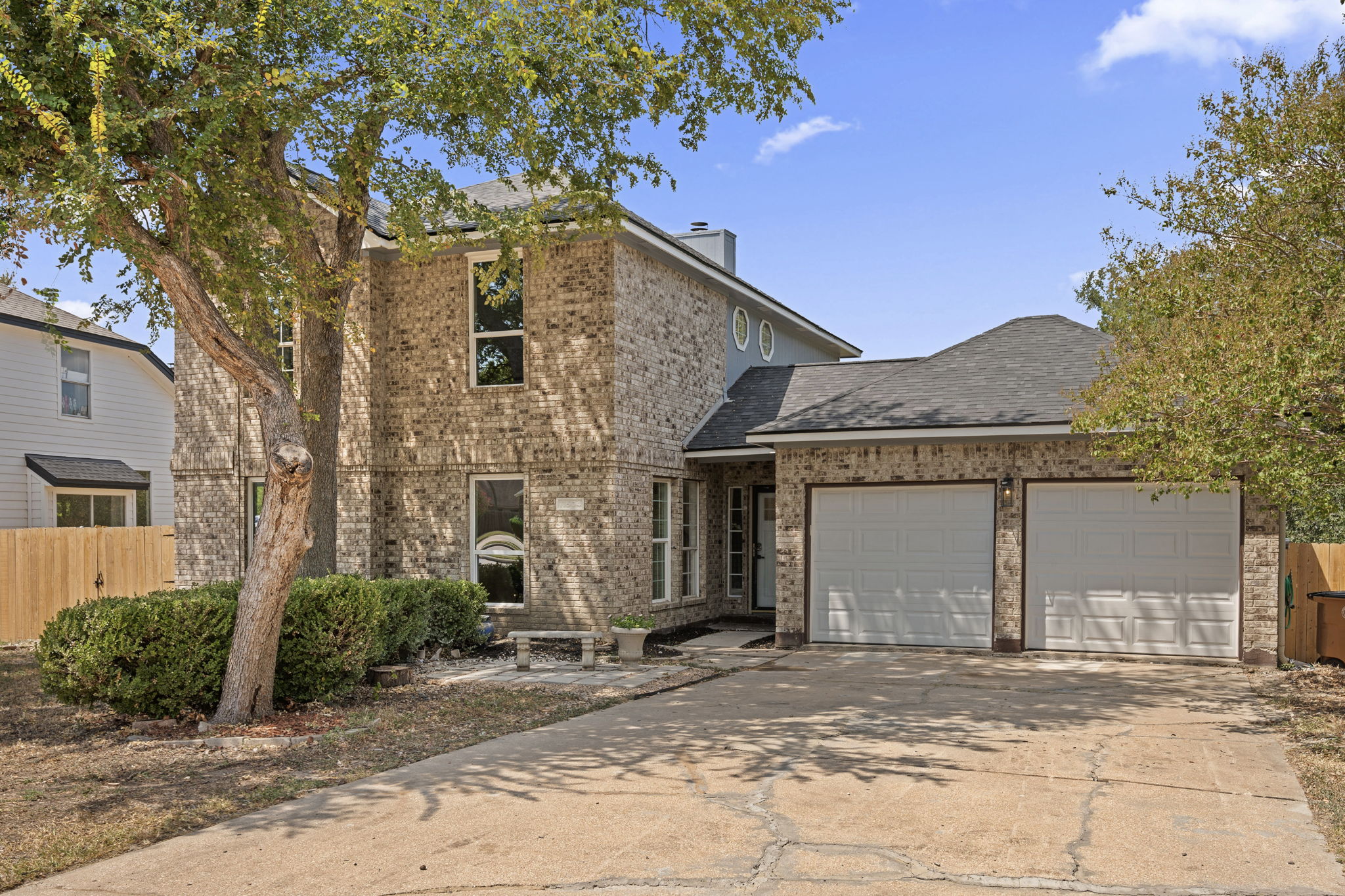 11604 Loweswater Lane Austin, TX 78754 - Photo 4 of 34 a front view of a house with a garden