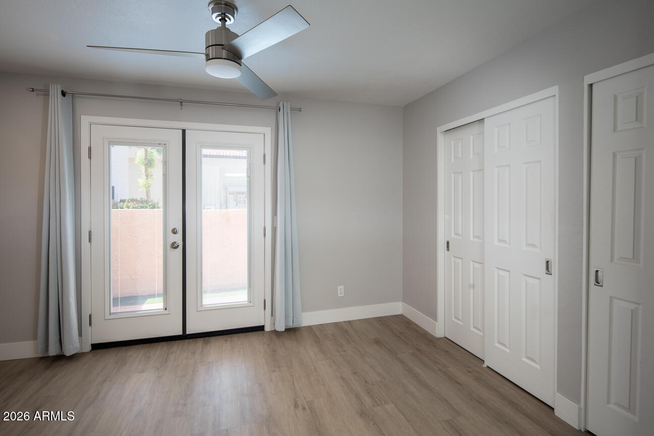 4540 North 44th Street, Unit 50 Phoenix, AZ 85018 - Photo 12 of 31 a view of empty room with wooden floor