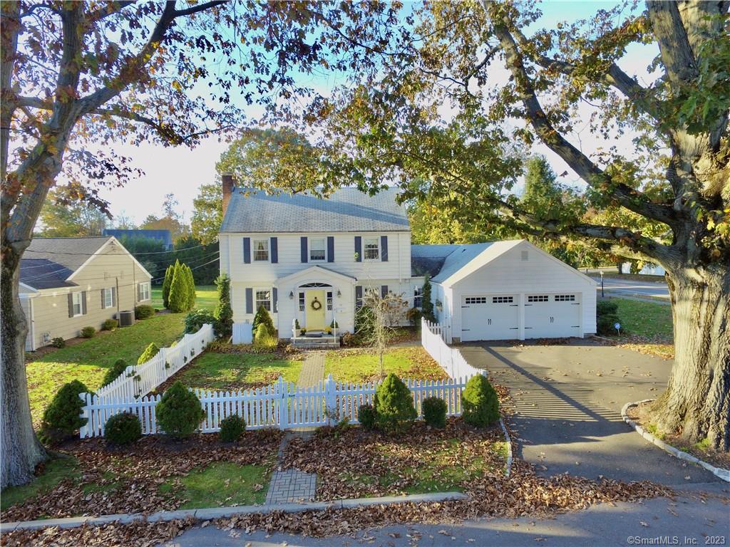 10 Westwood Road Fairfield, CT 06825 - Photo 1 of 1 a view of a house with a big yard plants and large tree