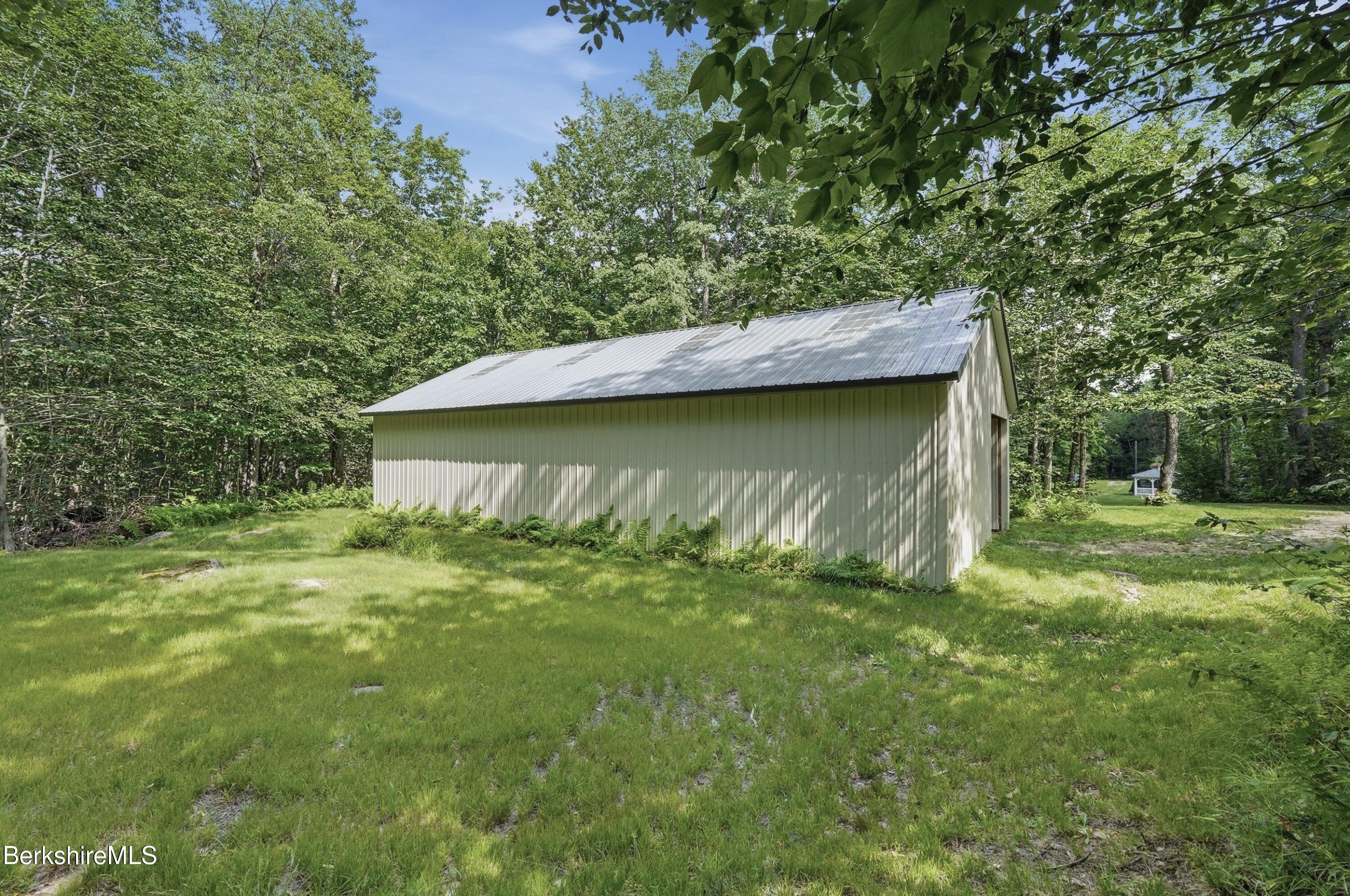 68 Curtin Road Peru, MA 01235 - Photo 15 of 38 a backyard of a house with lots of green space