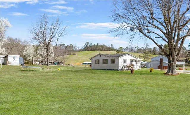 a view of a house with a yard