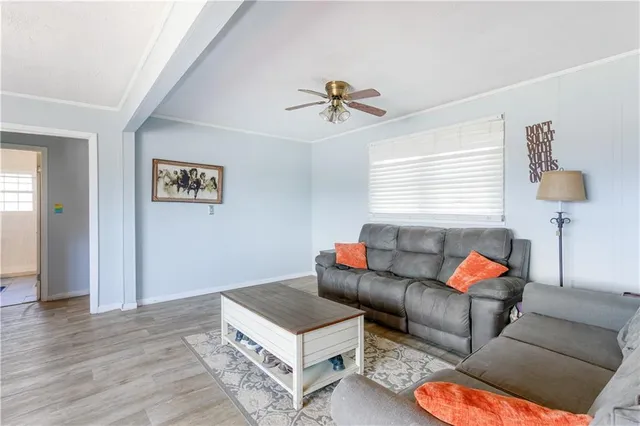 a living room with furniture and a lamp