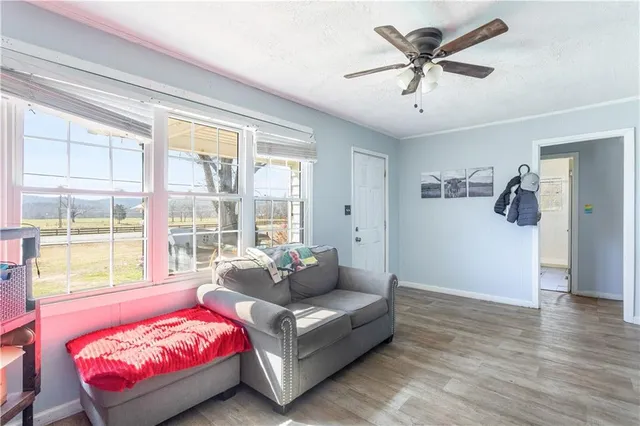 a living room with furniture and a large window