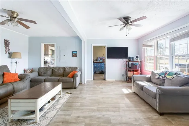 a living room with furniture and a flat screen tv