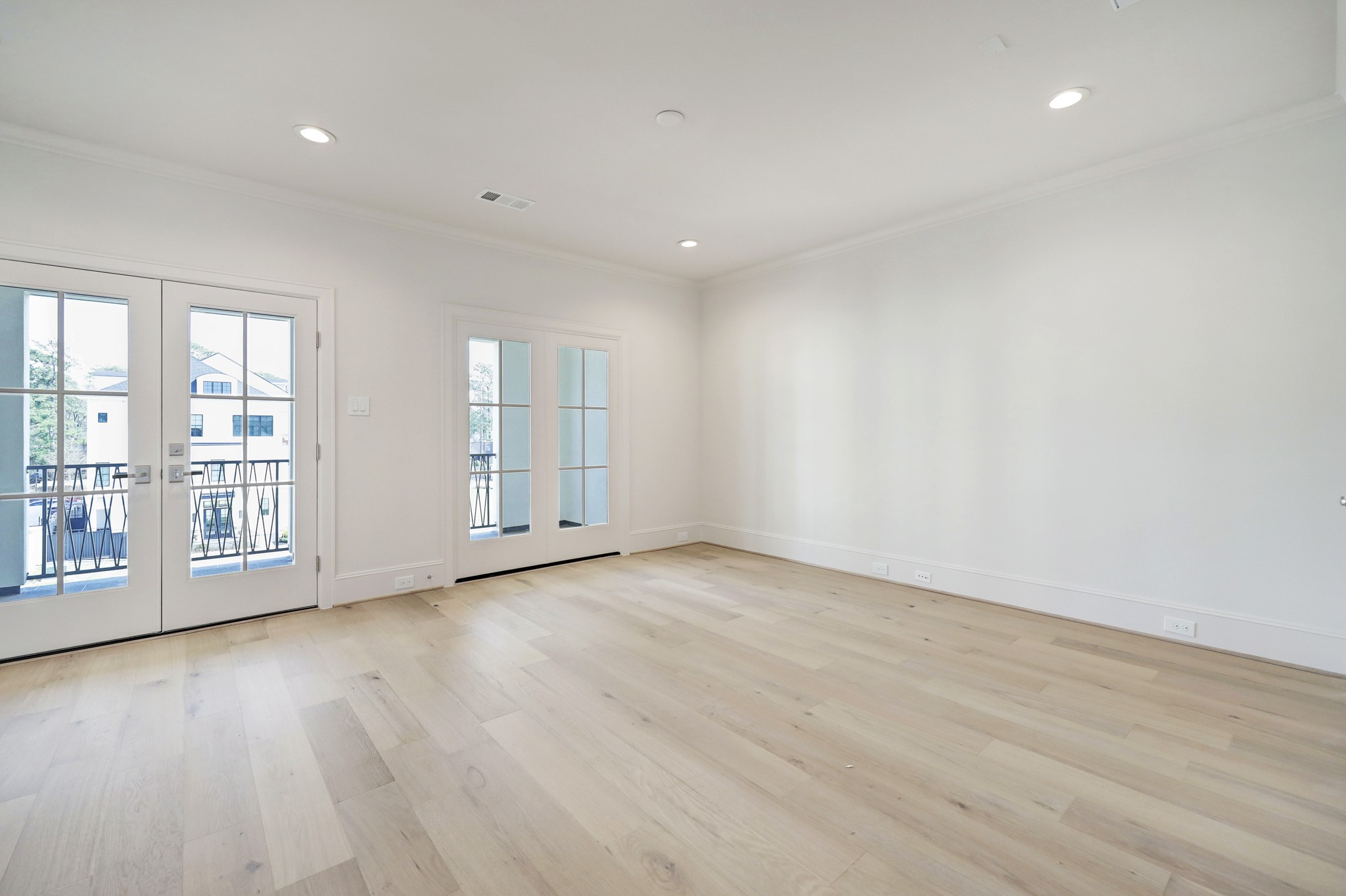 111 Wellington Row Road Houston, TX 77024 - Photo 15 of 19 wooden floor in an empty room with a window