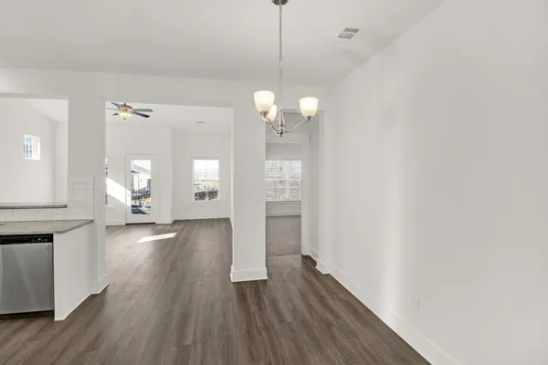 a view of a house and wooden floor