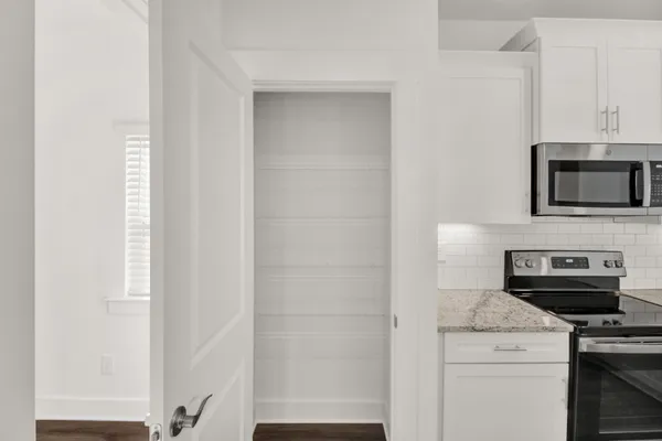 a kitchen with a stove and a microwave