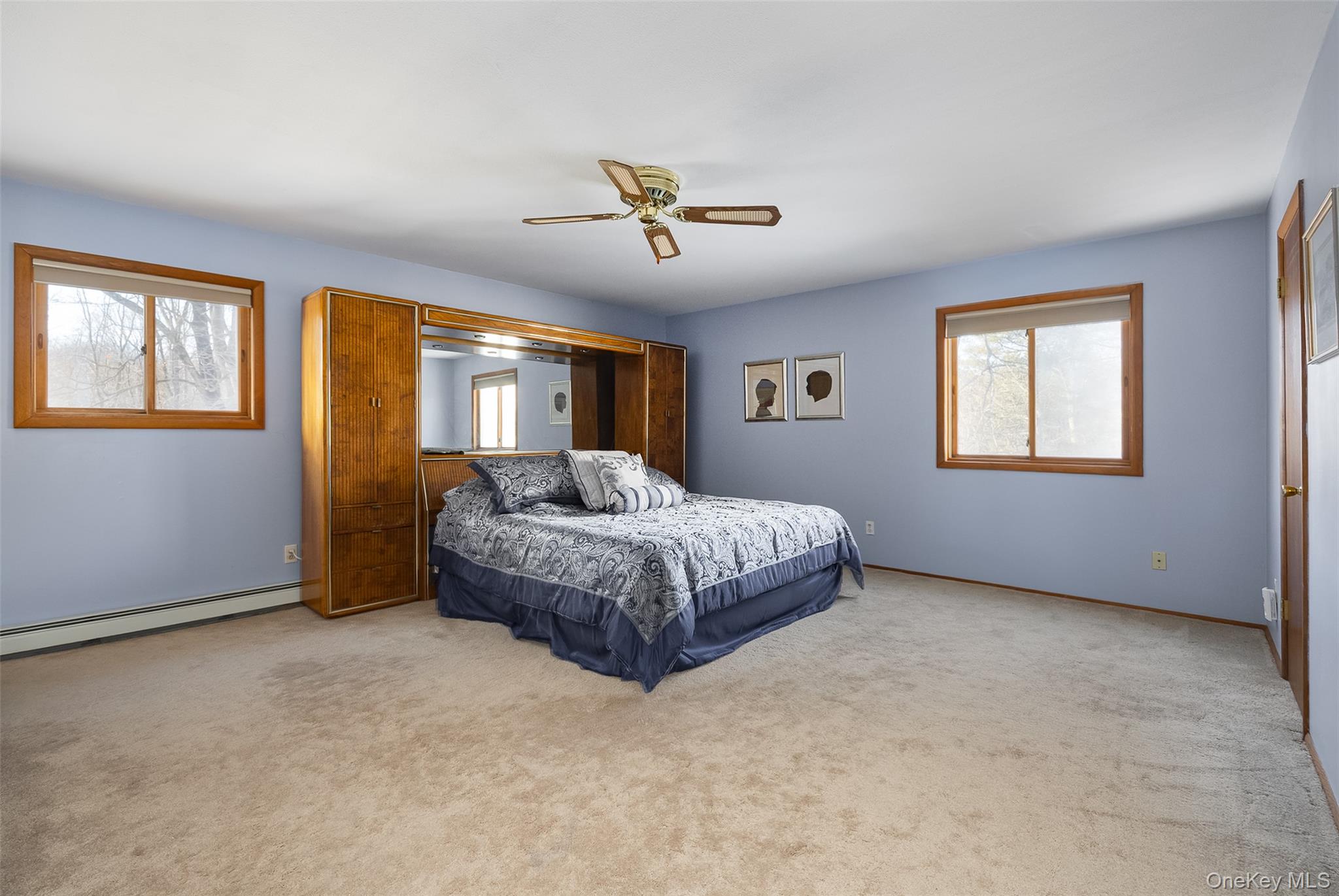 5 Chestnut Ridge Road Poughkeepsie, NY 12603 - Photo 17 of 39 a spacious bedroom with a bed dresser and a window