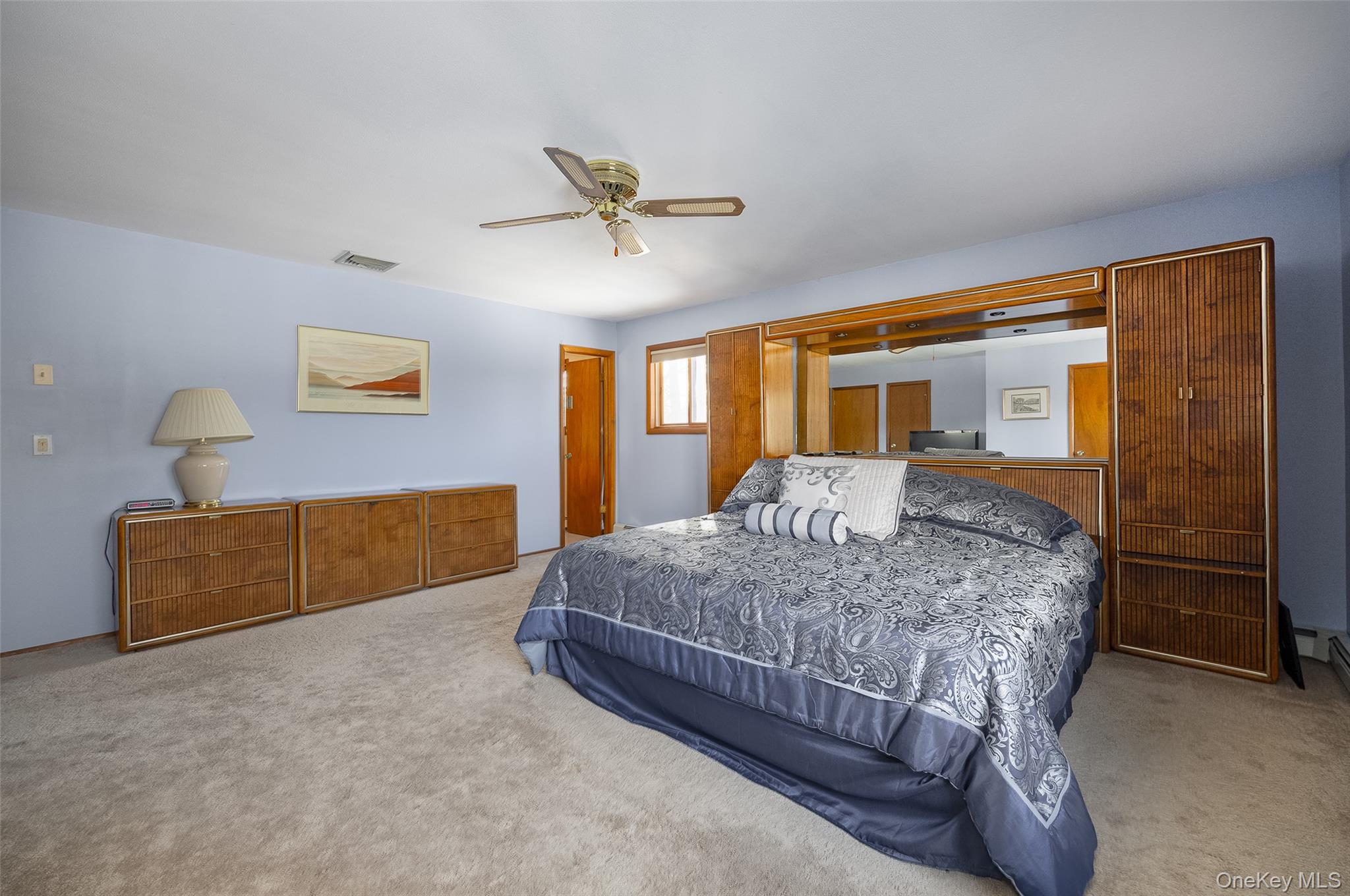 5 Chestnut Ridge Road Poughkeepsie, NY 12603 - Photo 18 of 39 a bedroom with a bed and dresser