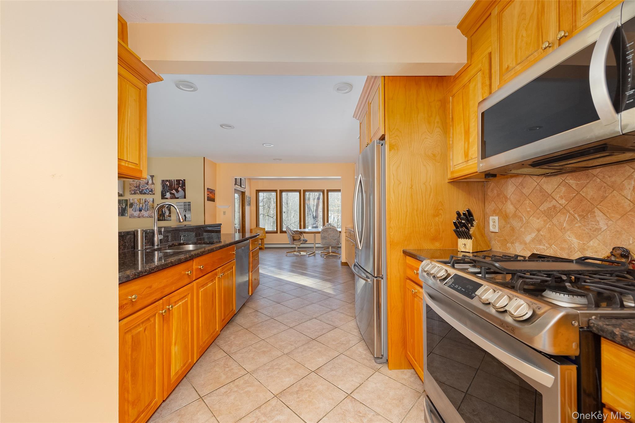 5 Chestnut Ridge Road Poughkeepsie, NY 12603 - Photo 7 of 39 a kitchen with stainless steel appliances granite countertop a stove and a refrigerator