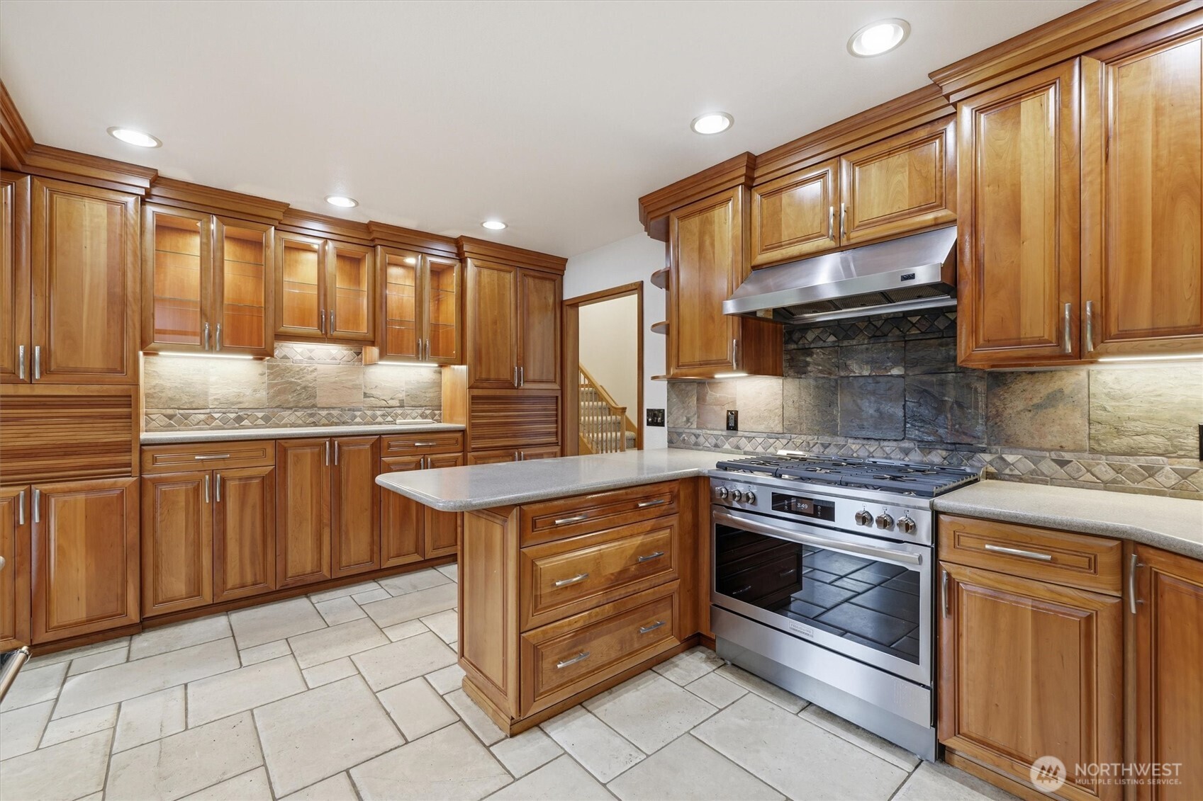 14312 63rd Avenue West Edmonds, WA 98026 - Photo 11 of 40 a kitchen with stainless steel appliances granite countertop a stove a sink and a microwave