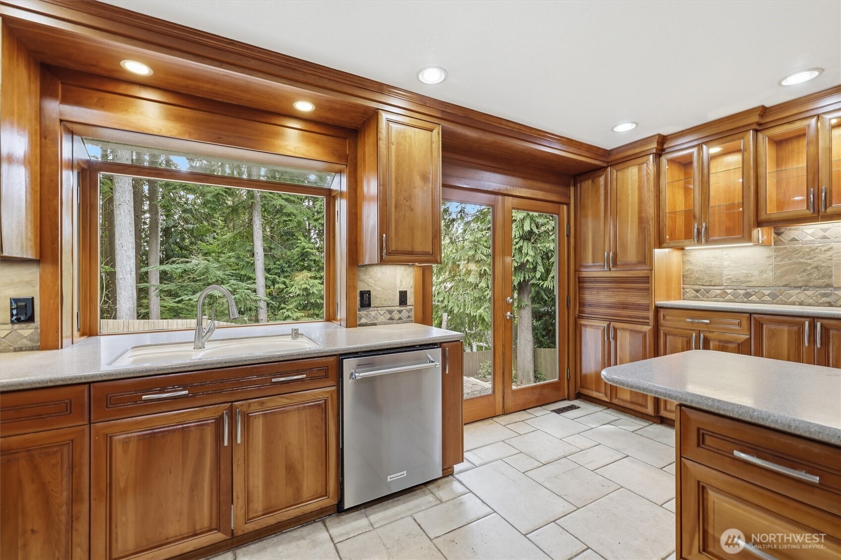 14312 63rd Avenue West Edmonds, WA 98026 - Photo 12 of 40 a kitchen with granite countertop a stove a sink and cabinetry