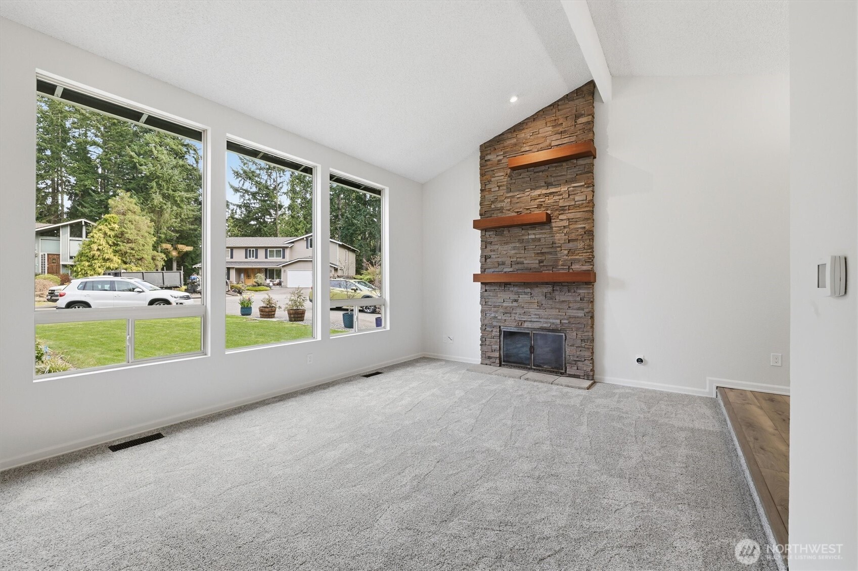 14312 63rd Avenue West Edmonds, WA 98026 - Photo 18 of 40 a view of an empty room with a fireplace and a window