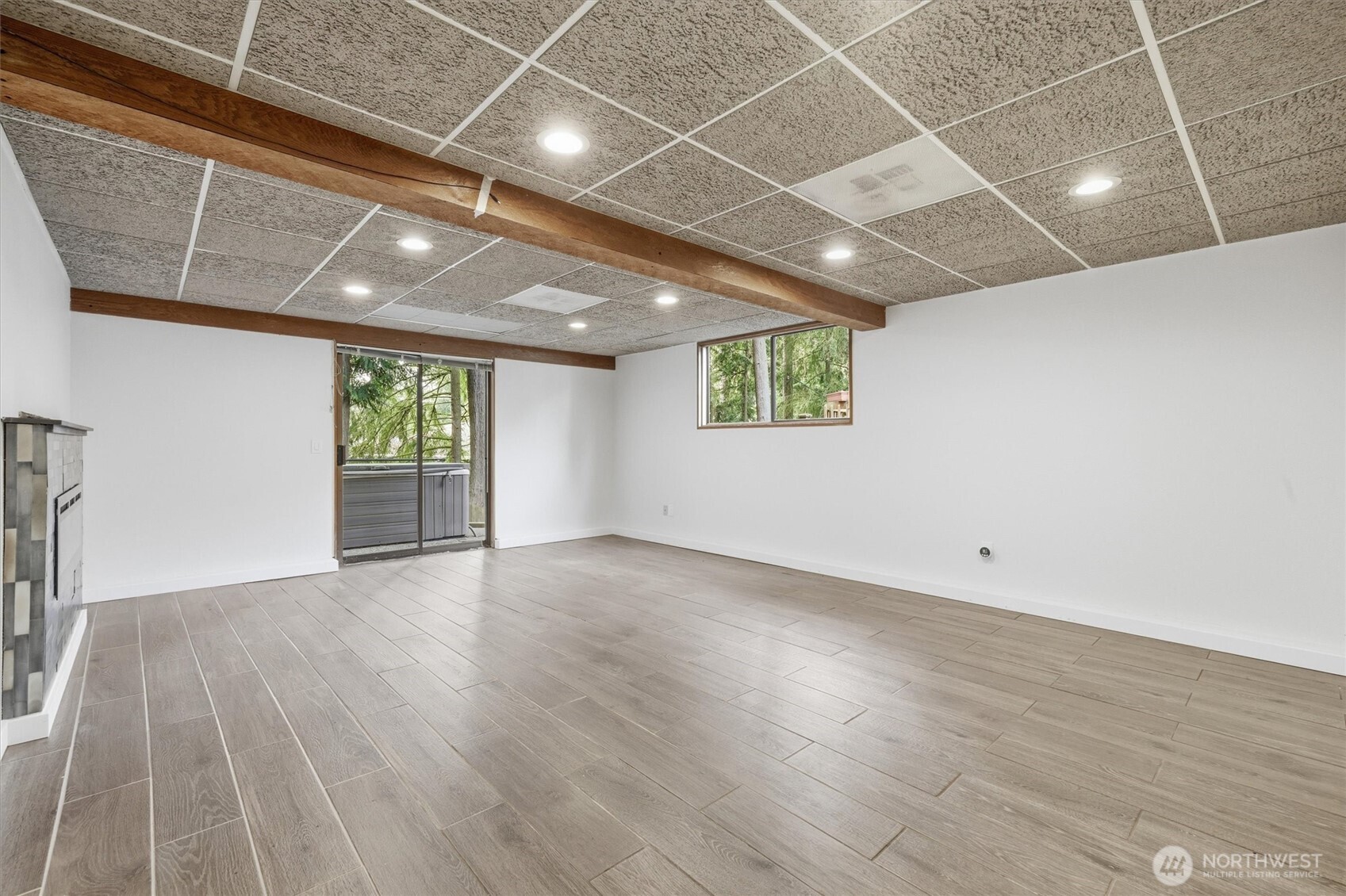 14312 63rd Avenue West Edmonds, WA 98026 - Photo 20 of 40 an empty room with wooden floor and windows