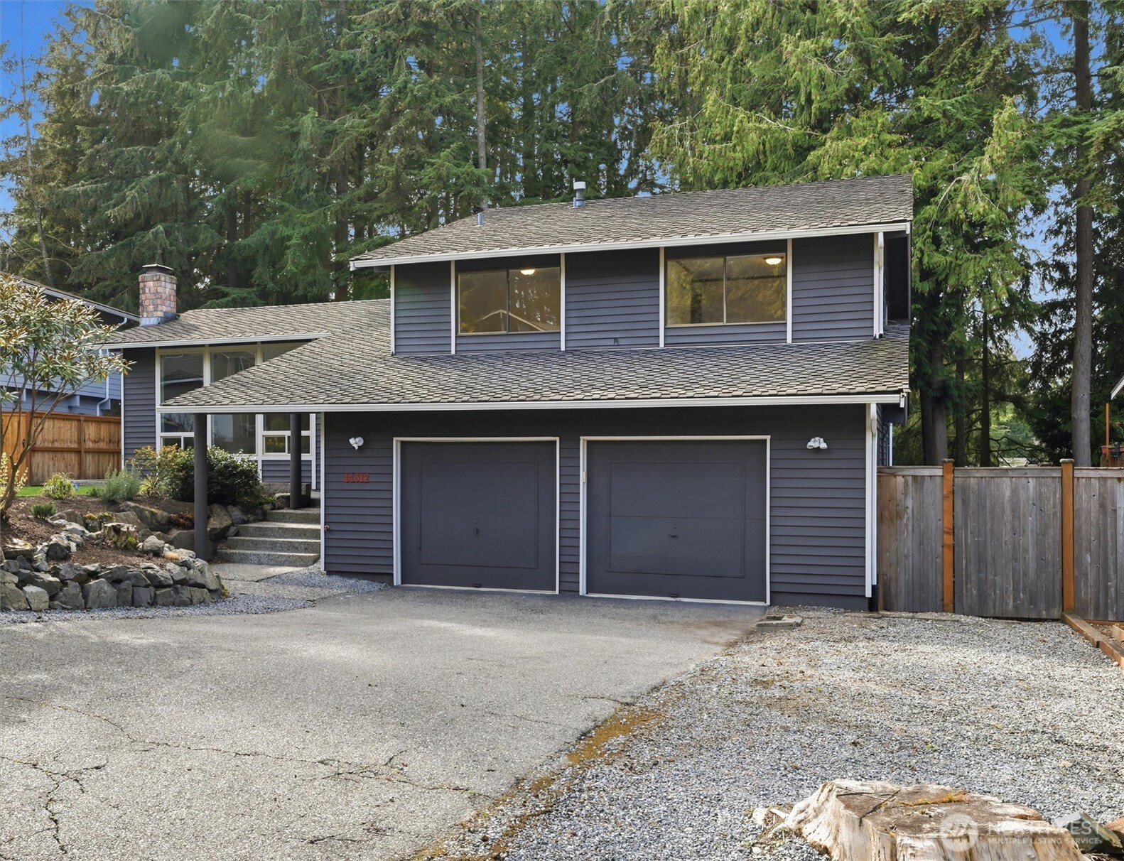14312 63rd Avenue West Edmonds, WA 98026 - Photo 2 of 40 a front view of a house with a yard and garage