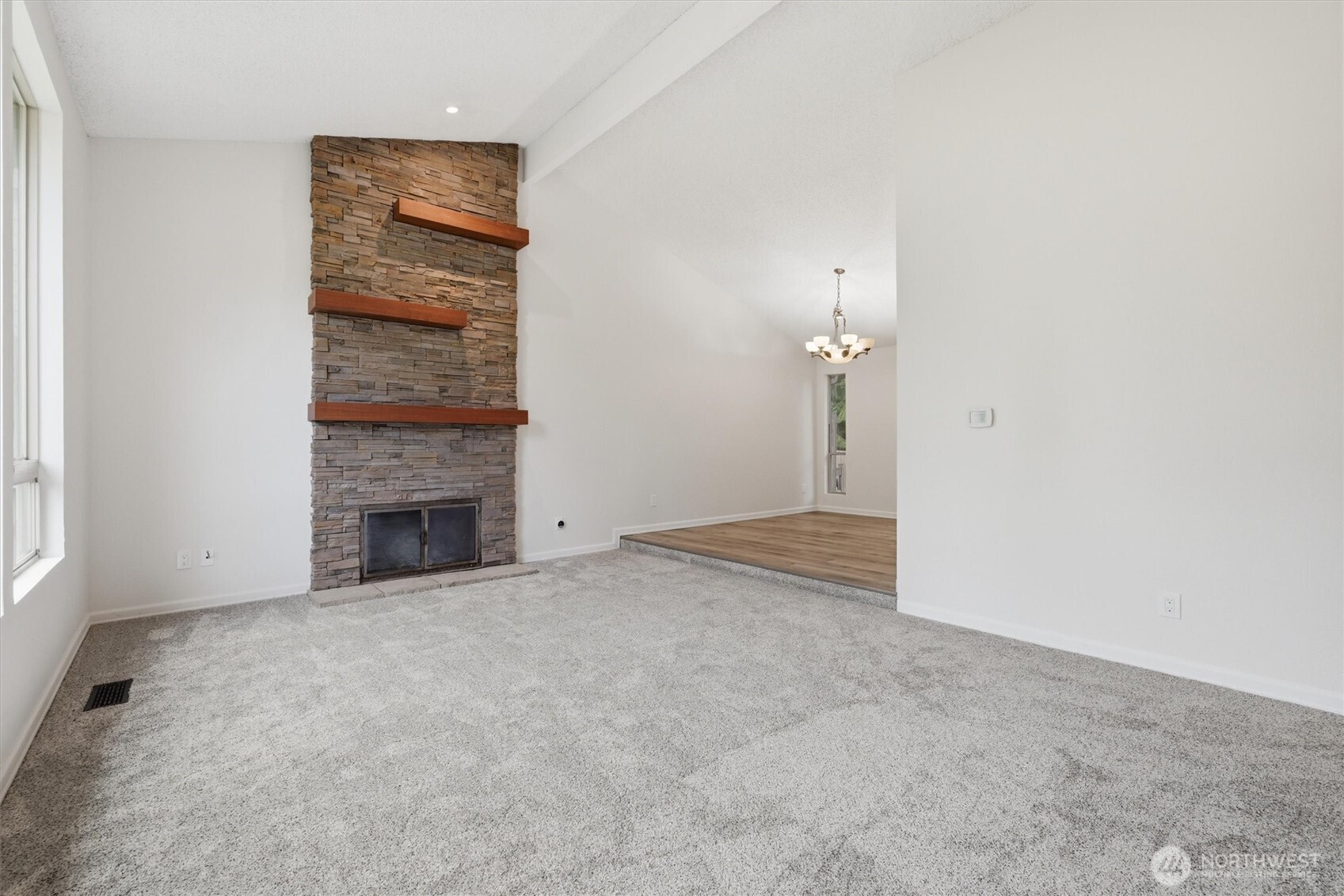 14312 63rd Avenue West Edmonds, WA 98026 - Photo 8 of 40 a view of an empty room with a fireplace and a window