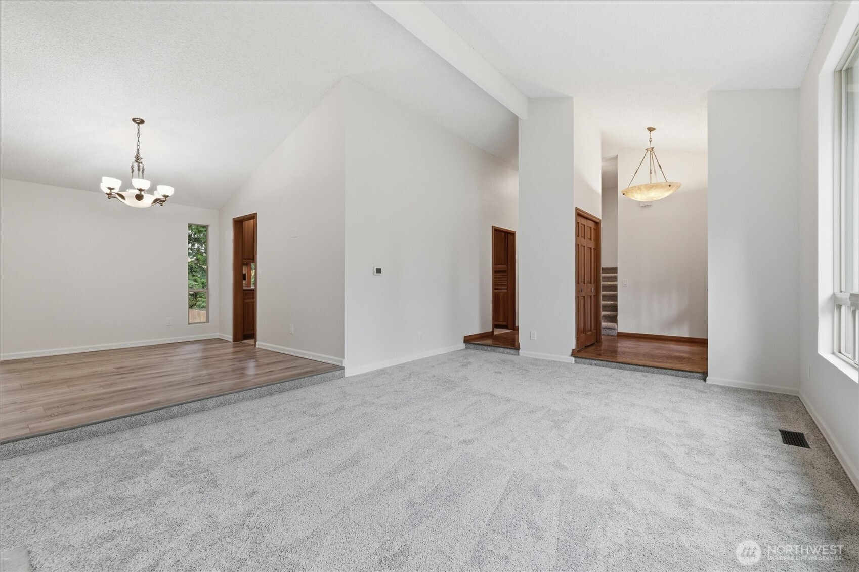 14312 63rd Avenue West Edmonds, WA 98026 - Photo 9 of 40 an empty room with chandelier fan and windows