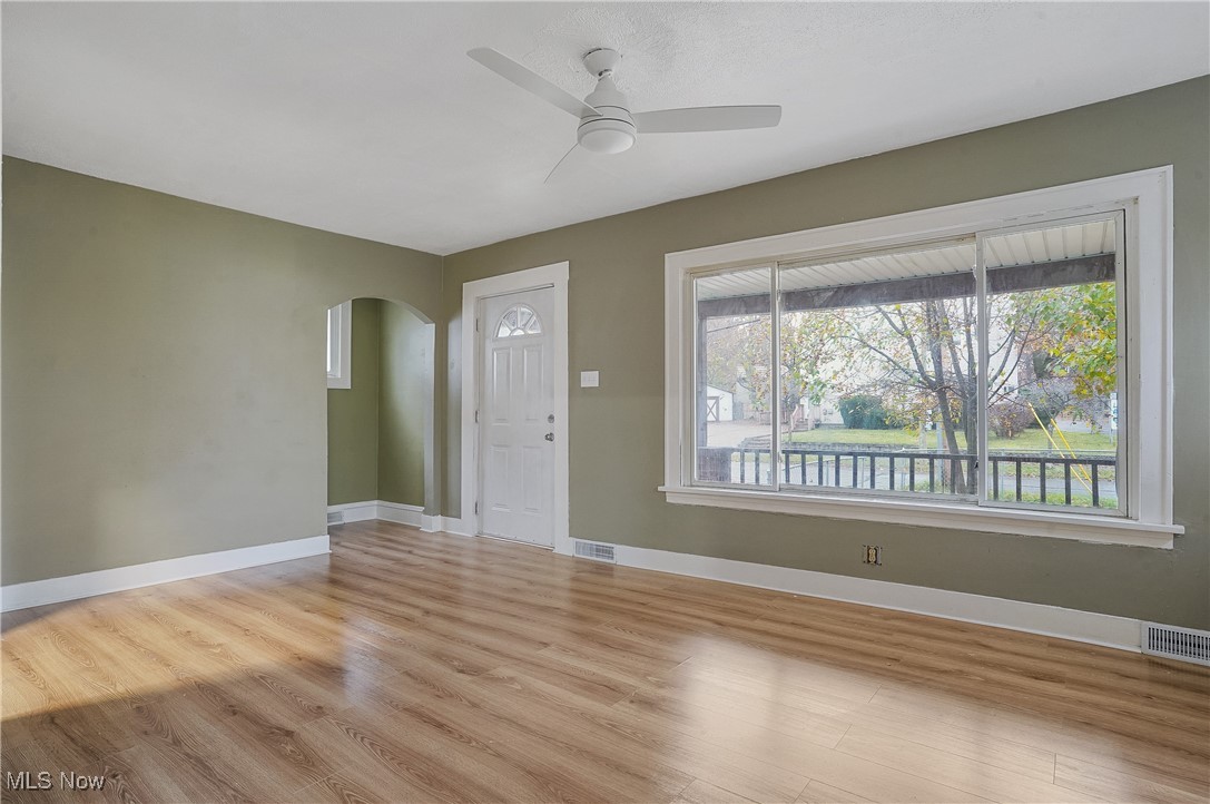 888 Dan Street Akron, OH 44310 - Photo 9 of 36 Unfurnished living room featuring light wood-type flooring and ceiling fan