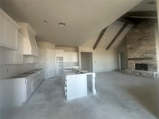 a kitchen with a sink and a stove top oven