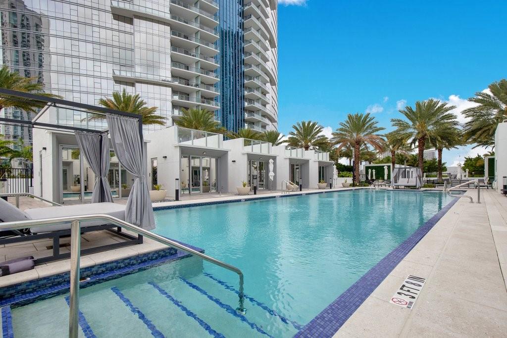851 Northeast 1st Avenue, Unit 2202 Miami, FL 33132 - Photo 45 of 56 a view of a house with pool and a yard