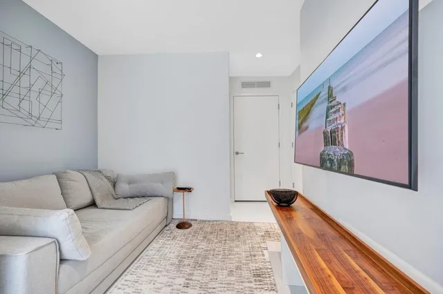 a living room with furniture and a rug