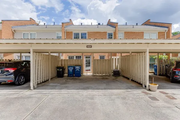 a view of a car is parked in front of a building